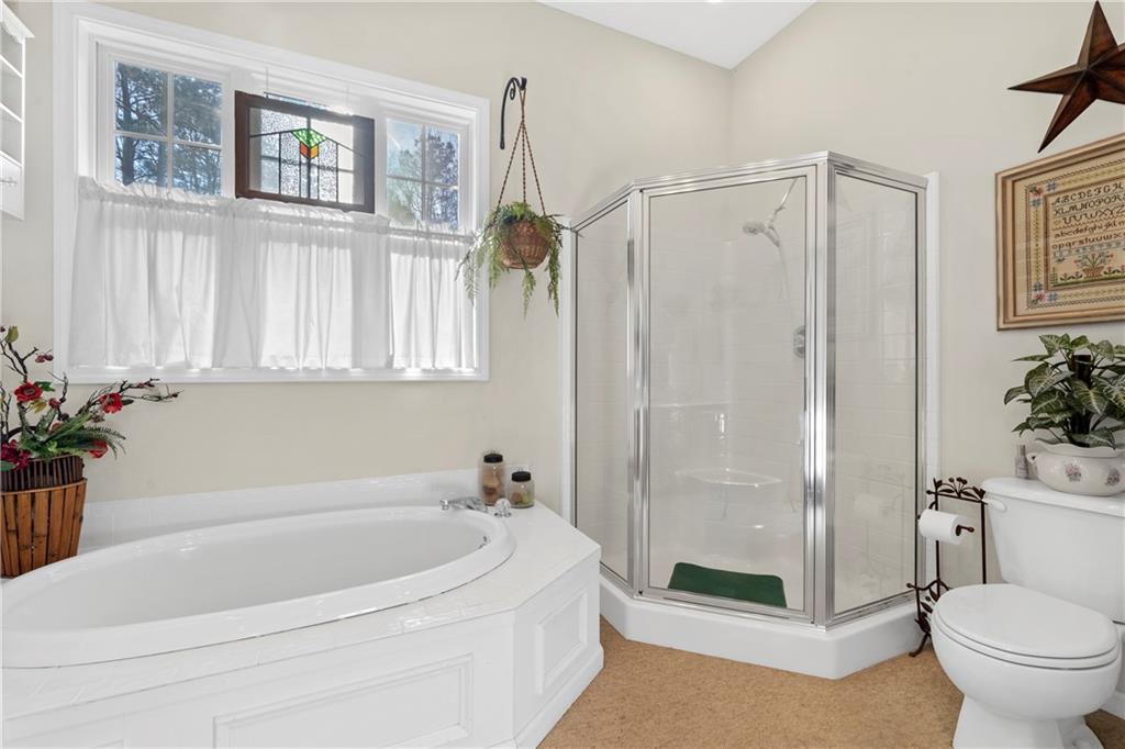 125 Lowe Road Northwest Milledgeville, GA 31061 - Photo 13 of 62 a bath room with a toilet and a bath tub