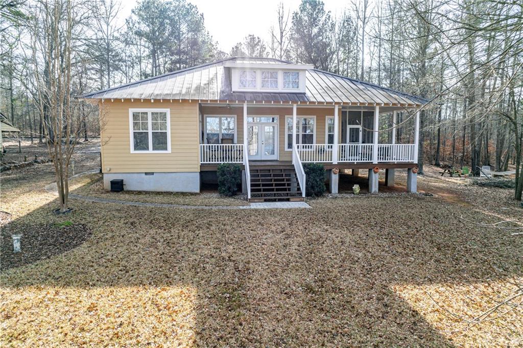 125 Lowe Road Northwest Milledgeville, GA 31061 - Photo 15 of 73 a front view of a house with a garden