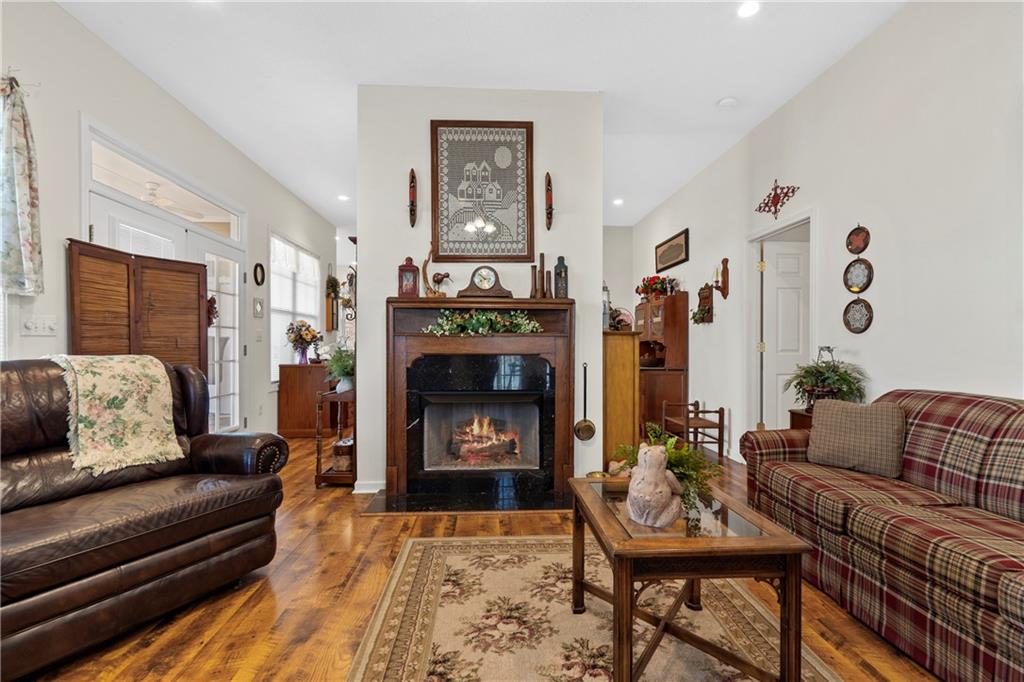 125 Lowe Road Northwest Milledgeville, GA 31061 - Photo 17 of 73 a living room with furniture and a fireplace
