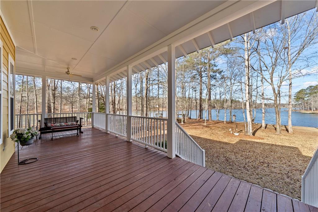 125 Lowe Road Northwest Milledgeville, GA 31061 - Photo 18 of 62 a dining room with large trees and a wooden floor