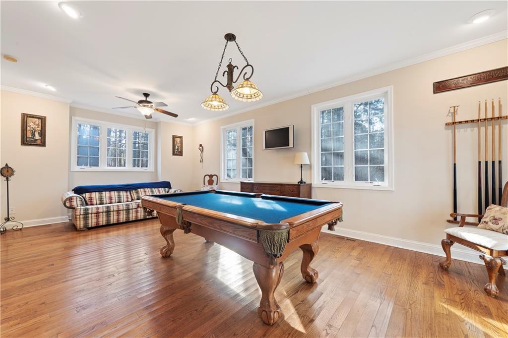 125 Lowe Road Northwest Milledgeville, GA 31061 - Photo 22 of 62 a room with pool table and windows