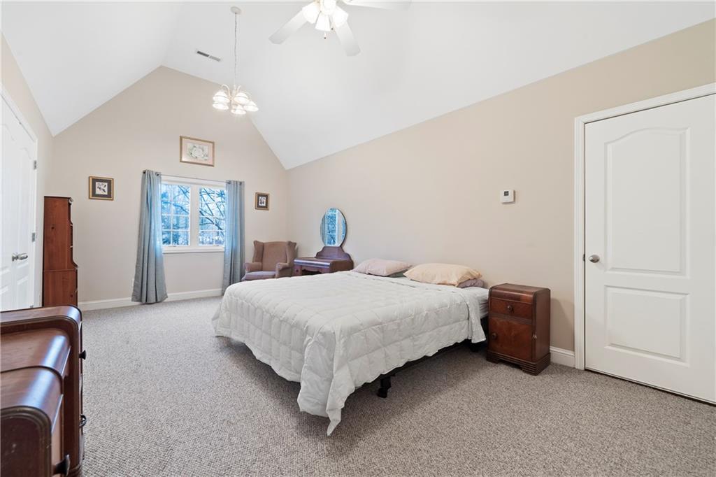 125 Lowe Road Northwest Milledgeville, GA 31061 - Photo 24 of 62 a bedroom with a bed and cabinets