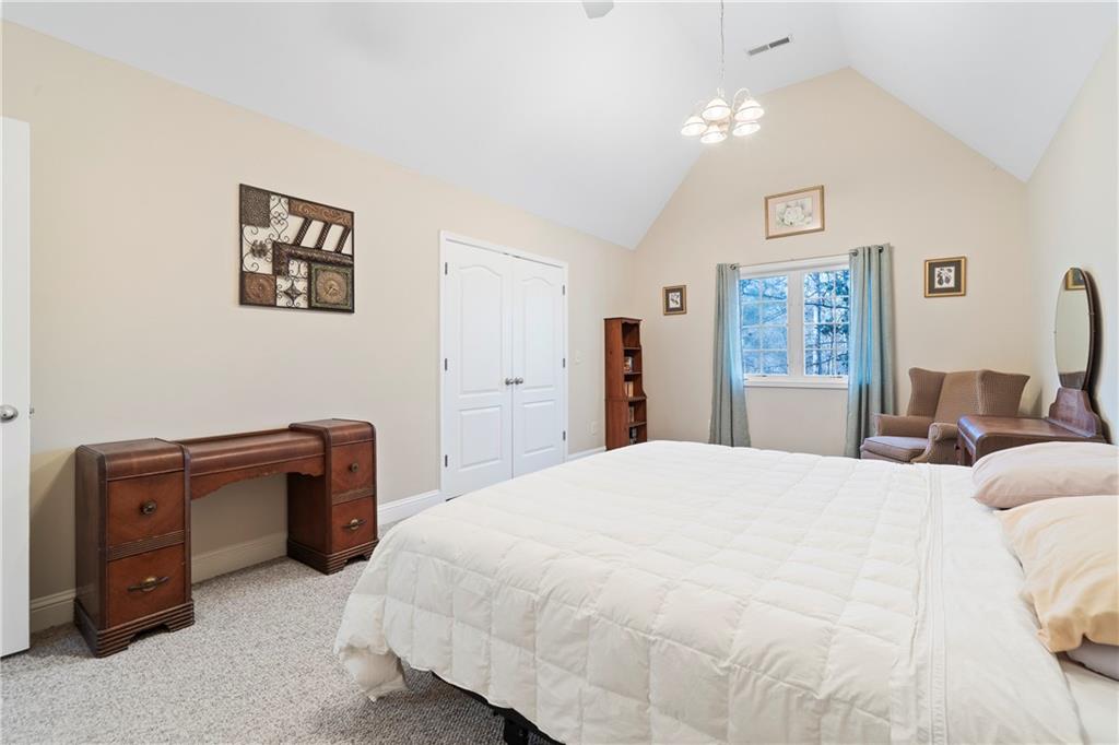 125 Lowe Road Northwest Milledgeville, GA 31061 - Photo 25 of 62 a bedroom with a bed and dresser
