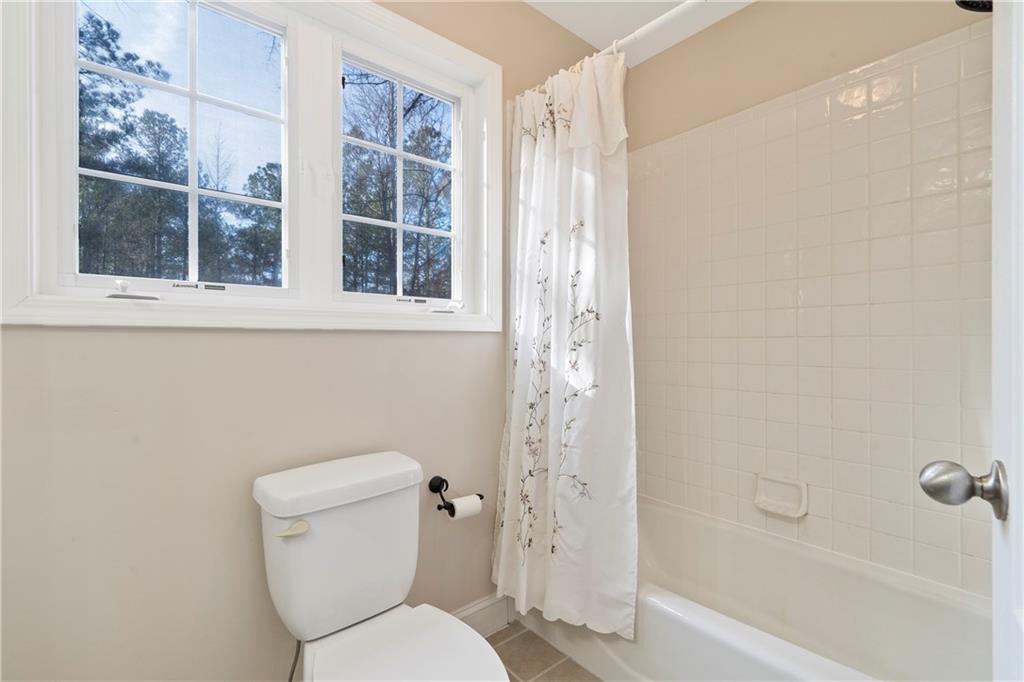 125 Lowe Road Northwest Milledgeville, GA 31061 - Photo 27 of 62 a white toilet sitting next to a bath tub