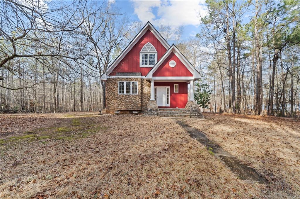 125 Lowe Road Northwest Milledgeville, GA 31061 - Photo 34 of 73 a front view of a house with garden