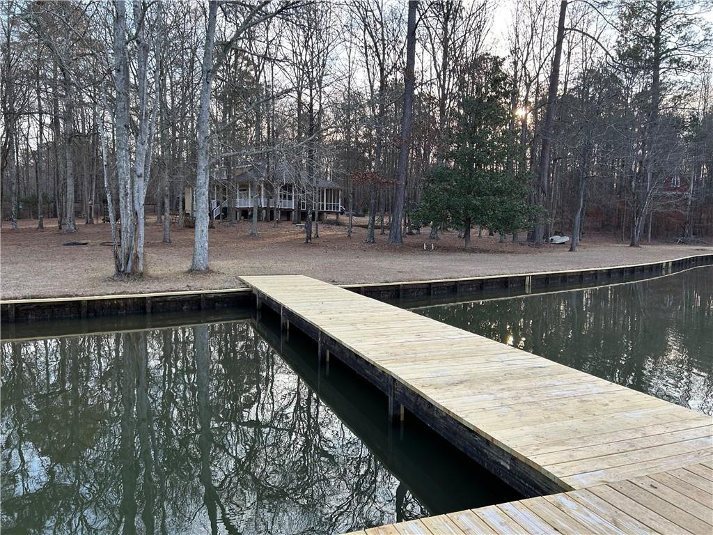 125 Lowe Road Northwest Milledgeville, GA 31061 - Photo 60 of 62 a view of swimming pool with a patio and lake view