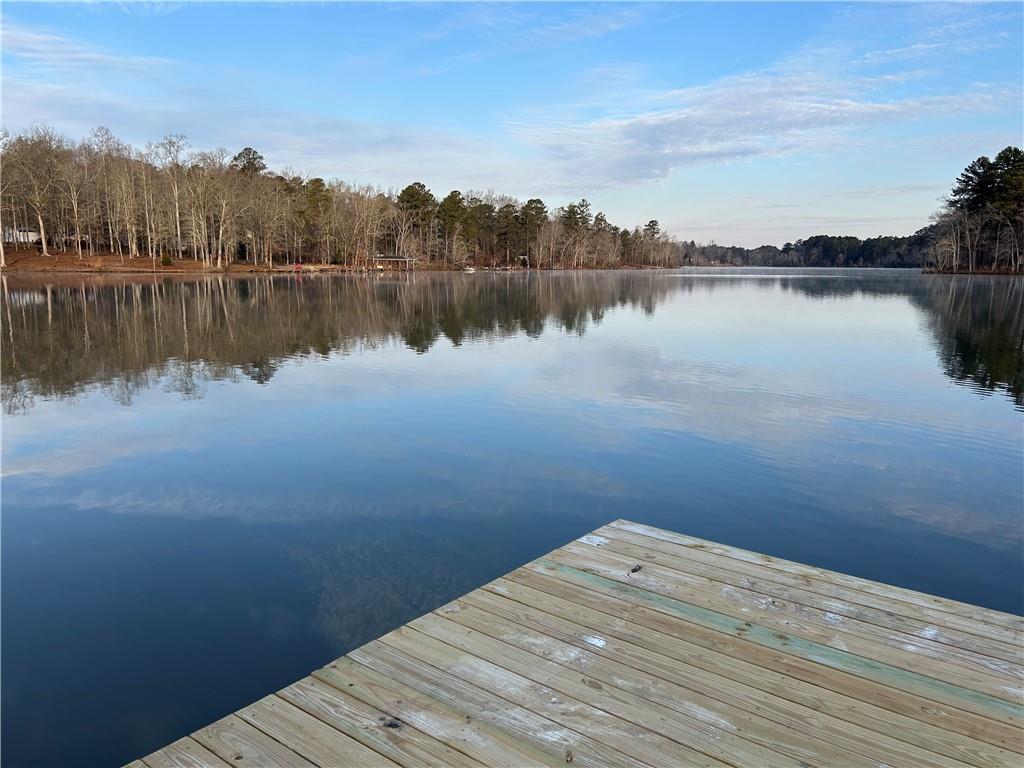 125 Lowe Road Northwest Milledgeville, GA 31061 - Photo 70 of 73 a view of a lake with houses in the back