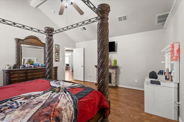 a bedroom with a bed and a dresser