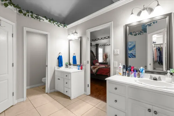 a spacious bathroom with a double vanity sink mirror and
