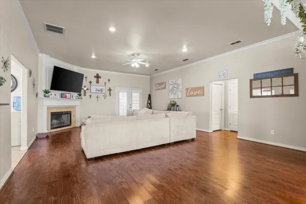 a living room with fireplace furniture and a flat screen tv