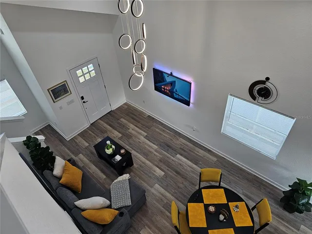 a living room with furniture and next to a window