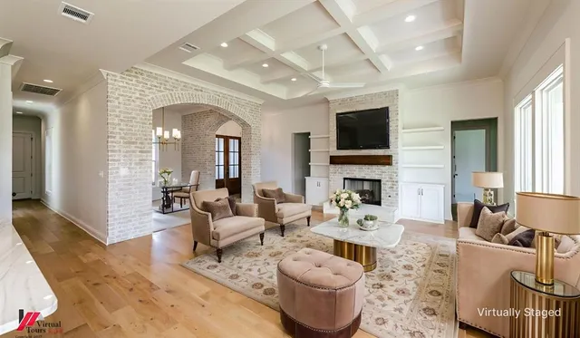 a living room with fireplace furniture and a flat screen tv