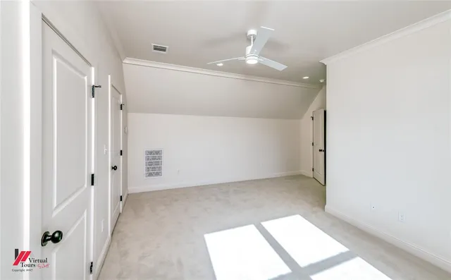 a view of a house with potted plants