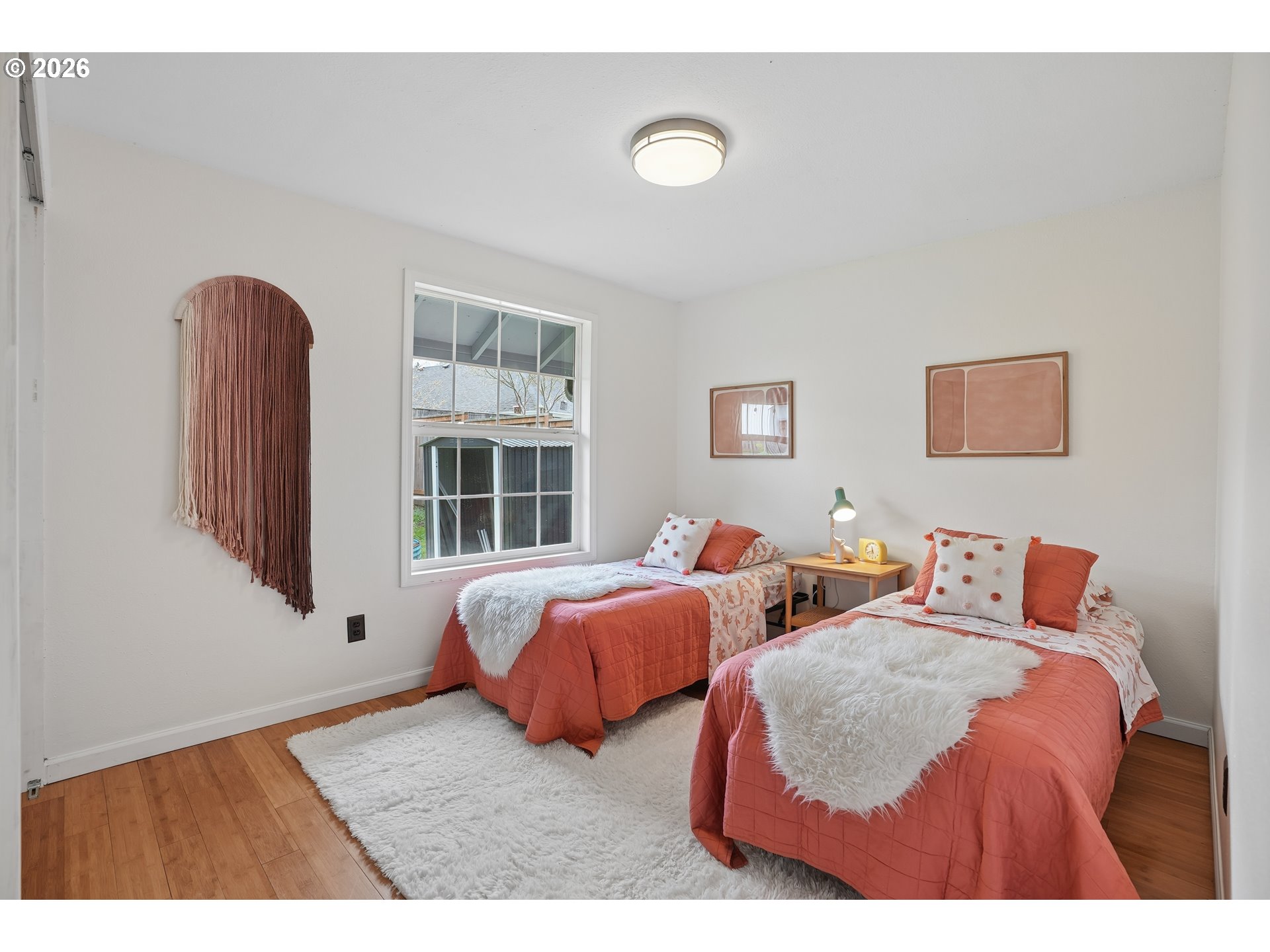 4030 Southwest 188th Avenue Beaverton, OR 97078 - Photo 11 of 20 a bedroom with two beds and windows