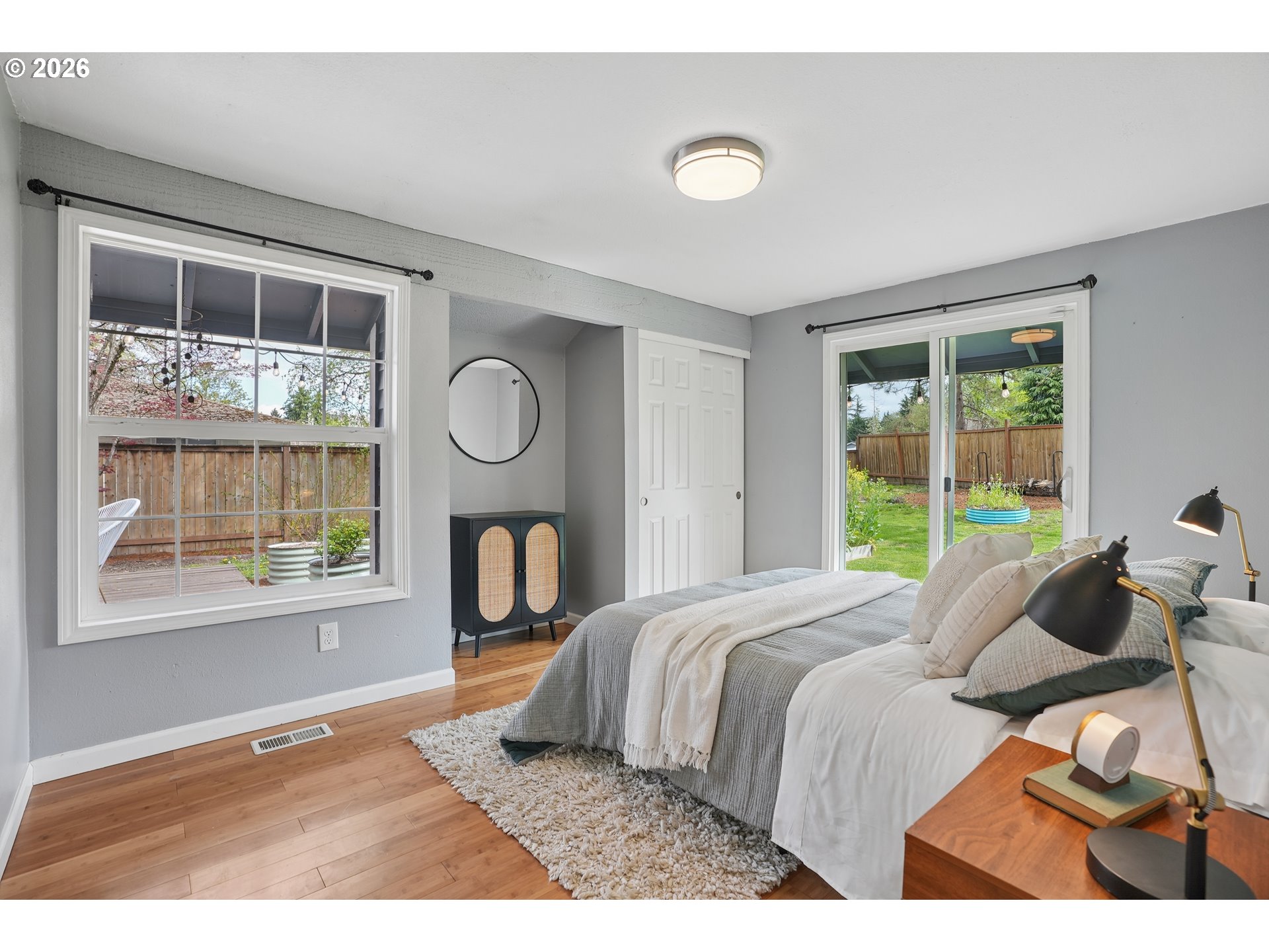 4030 Southwest 188th Avenue Beaverton, OR 97078 - Photo 12 of 20 a bedroom with a bed and wooden floor