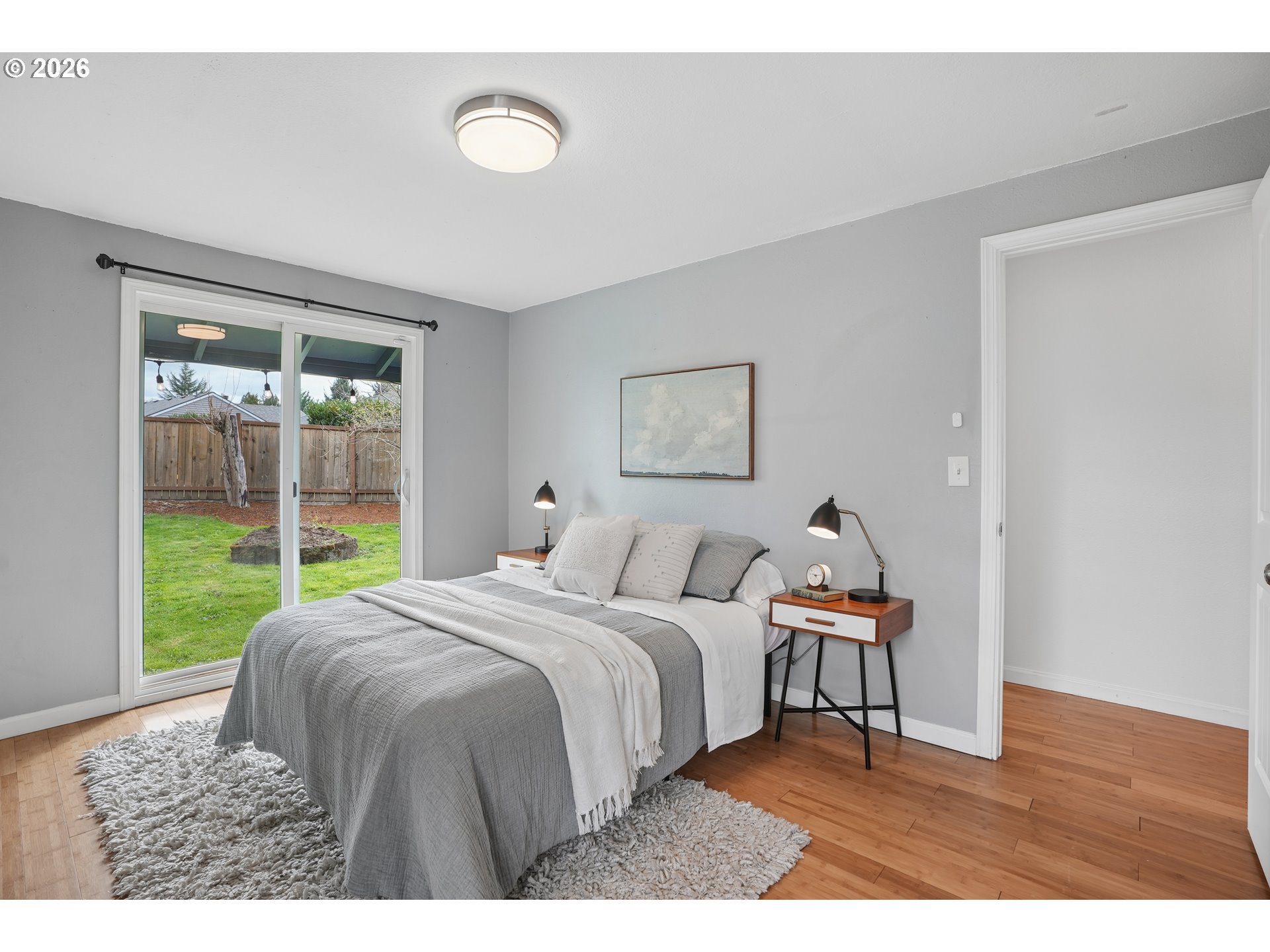 4030 Southwest 188th Avenue Beaverton, OR 97078 - Photo 13 of 20 a bedroom with a bed and a large window