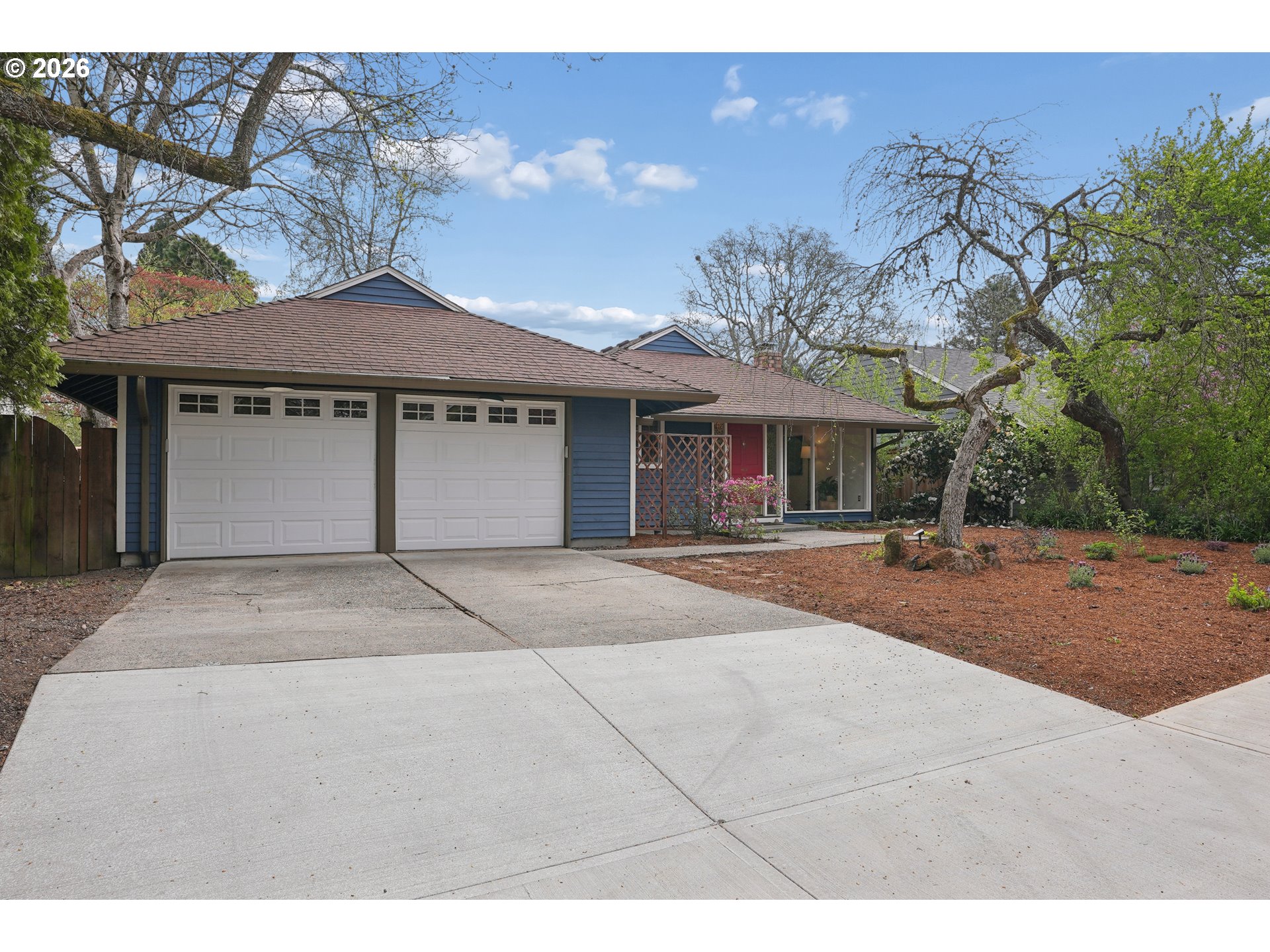 4030 Southwest 188th Avenue Beaverton, OR 97078 - Photo 19 of 20 a front view of a house with a yard and garage