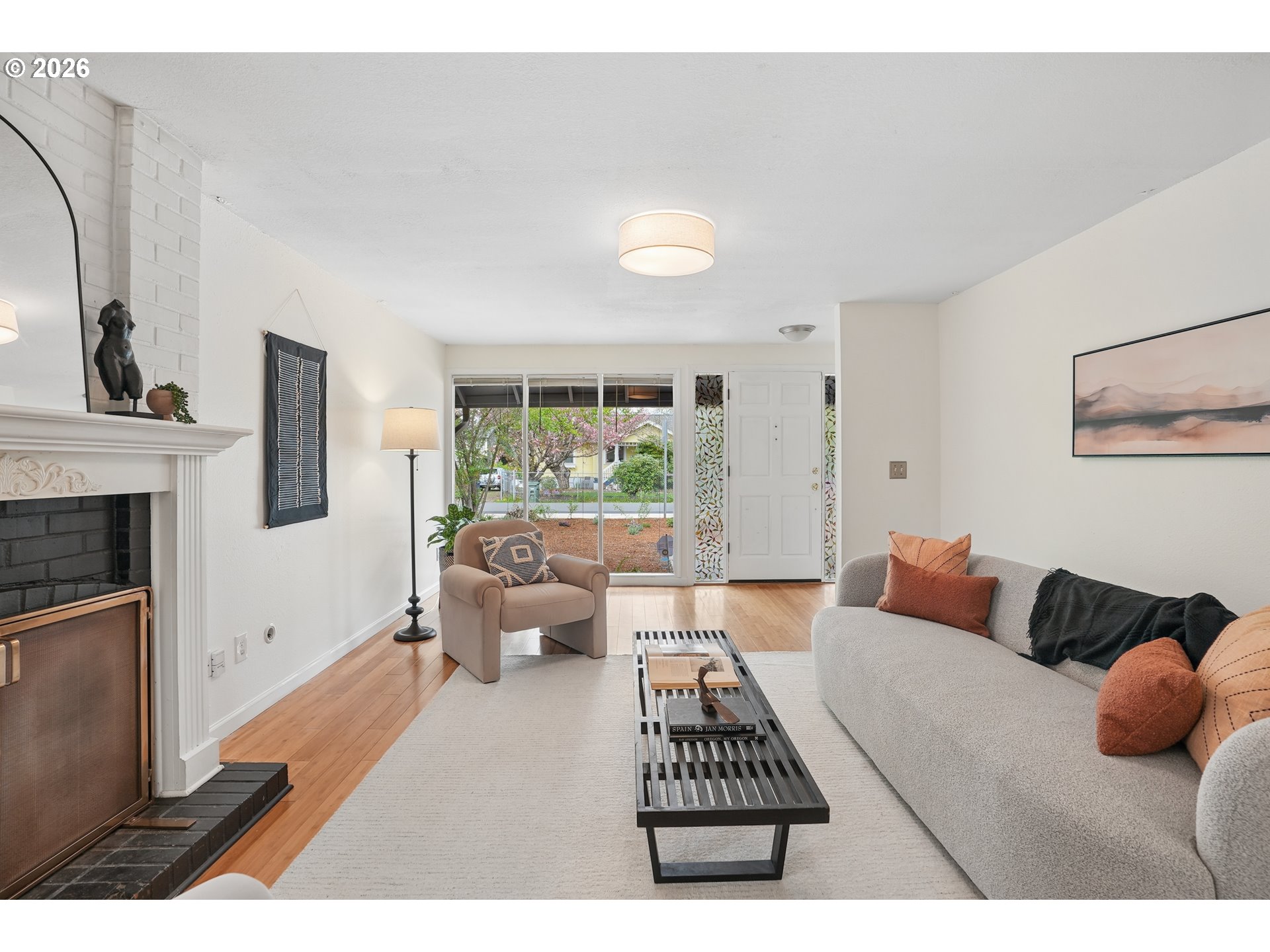 4030 Southwest 188th Avenue Beaverton, OR 97078 - Photo 2 of 20 a bedroom with furniture and a fireplace