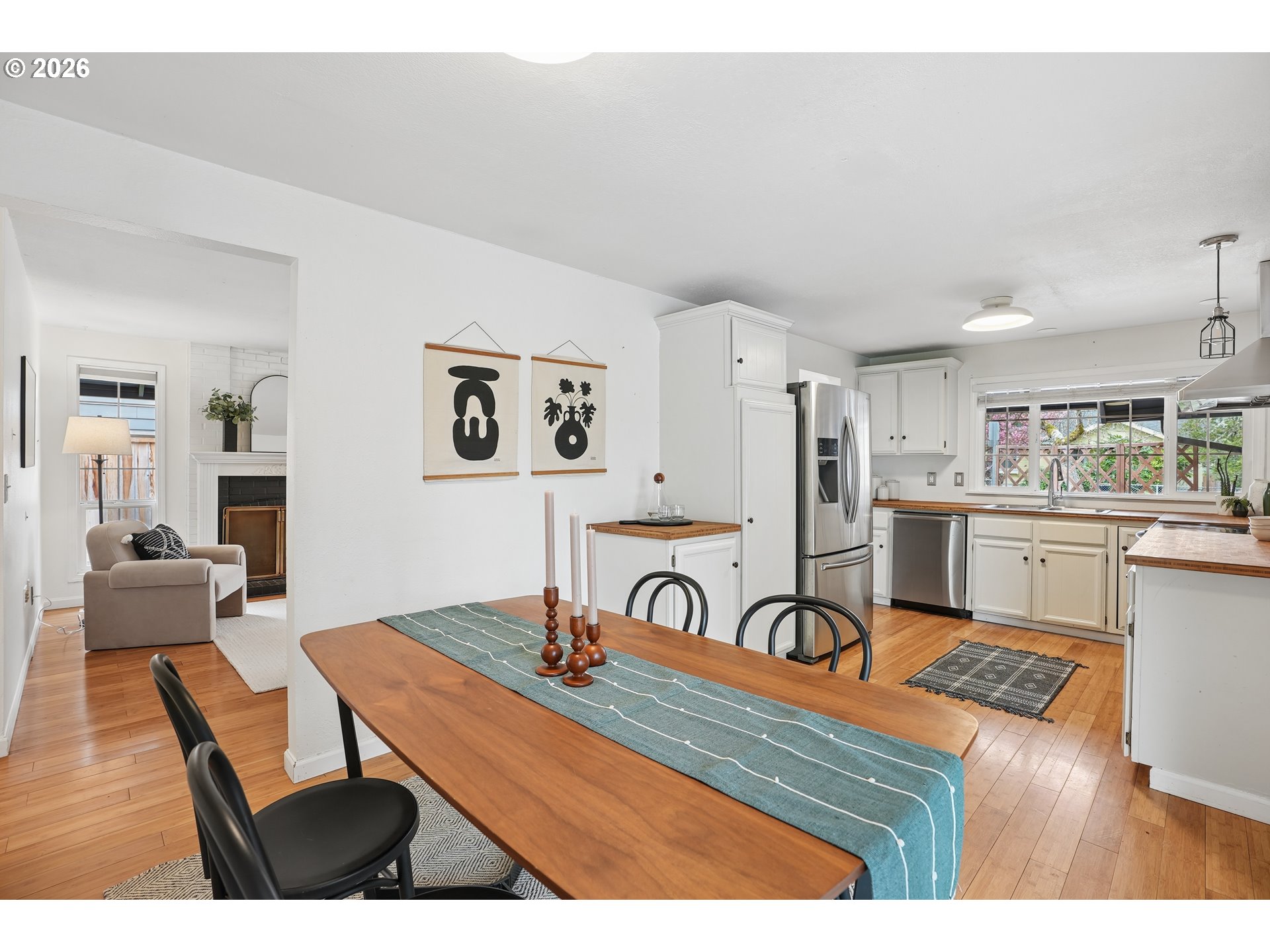 4030 Southwest 188th Avenue Beaverton, OR 97078 - Photo 5 of 20 a living room with stainless steel appliances kitchen island granite countertop furniture and a kitchen view