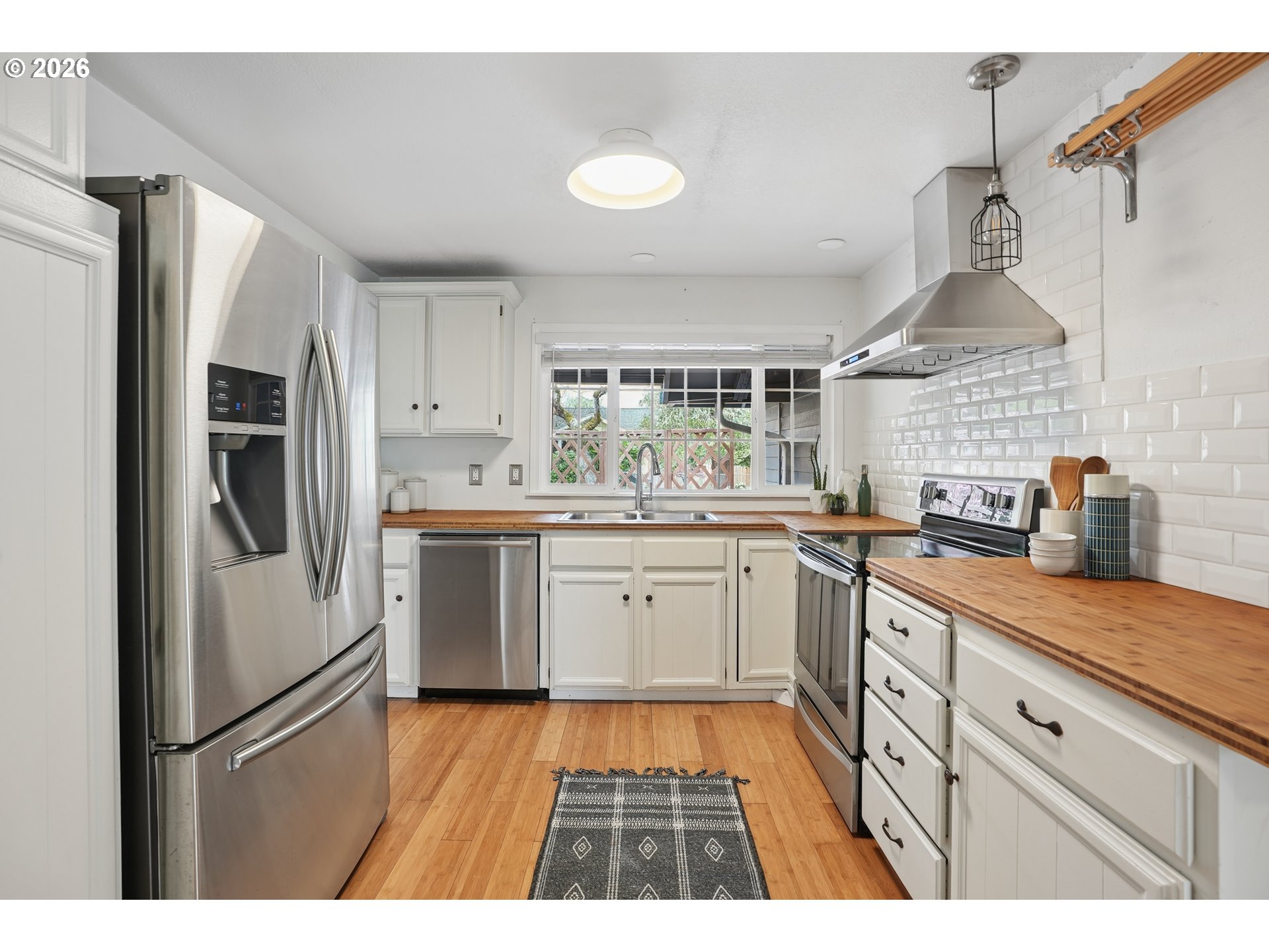 4030 Southwest 188th Avenue Beaverton, OR 97078 - Photo 6 of 20 a kitchen with granite countertop stainless steel appliances a sink and cabinets