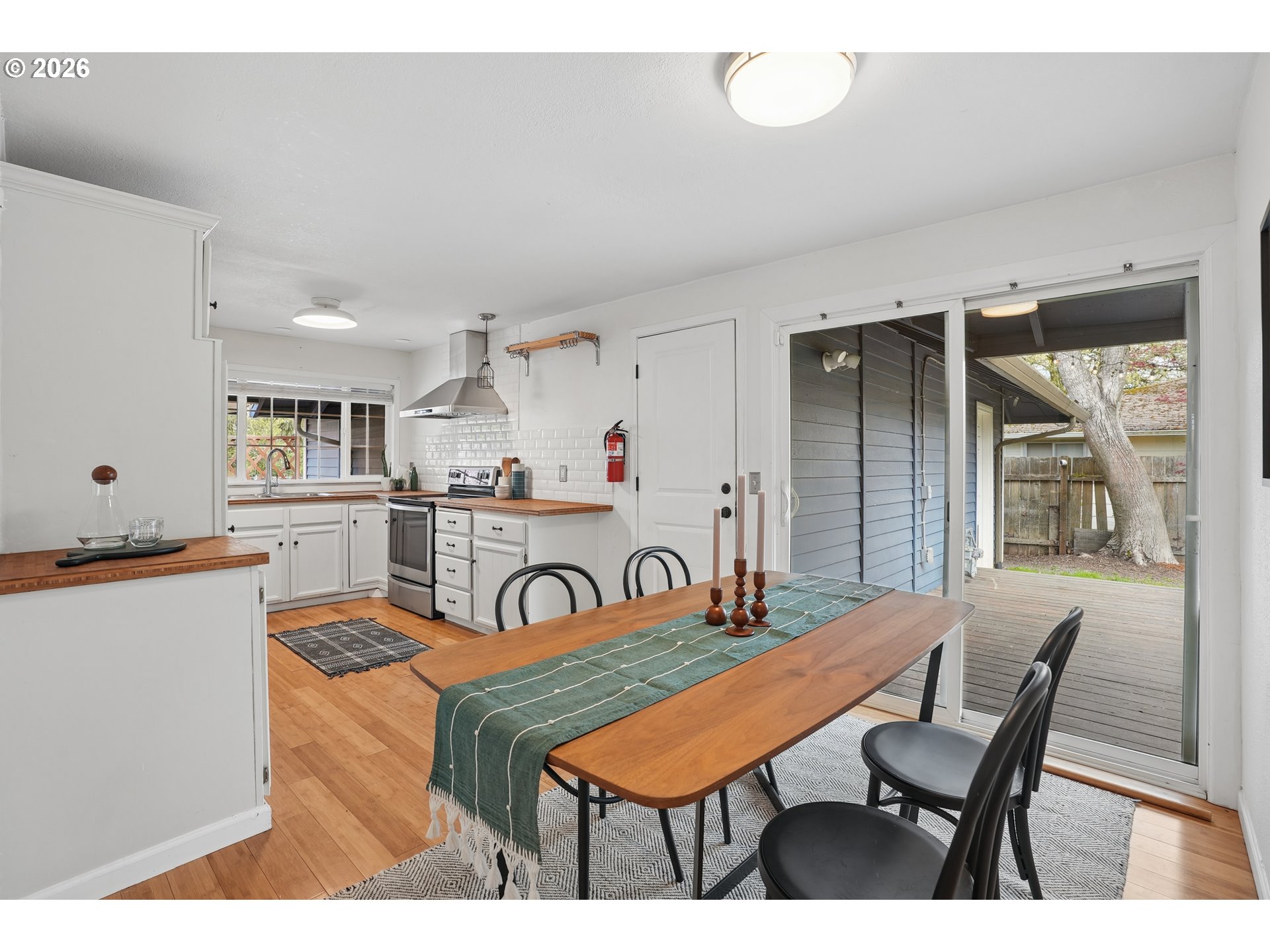 4030 Southwest 188th Avenue Beaverton, OR 97078 - Photo 7 of 20 a outdoor dining space with furniture and kitchen view