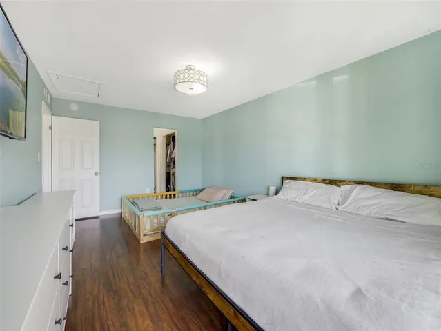 a bedroom with a bed and a table