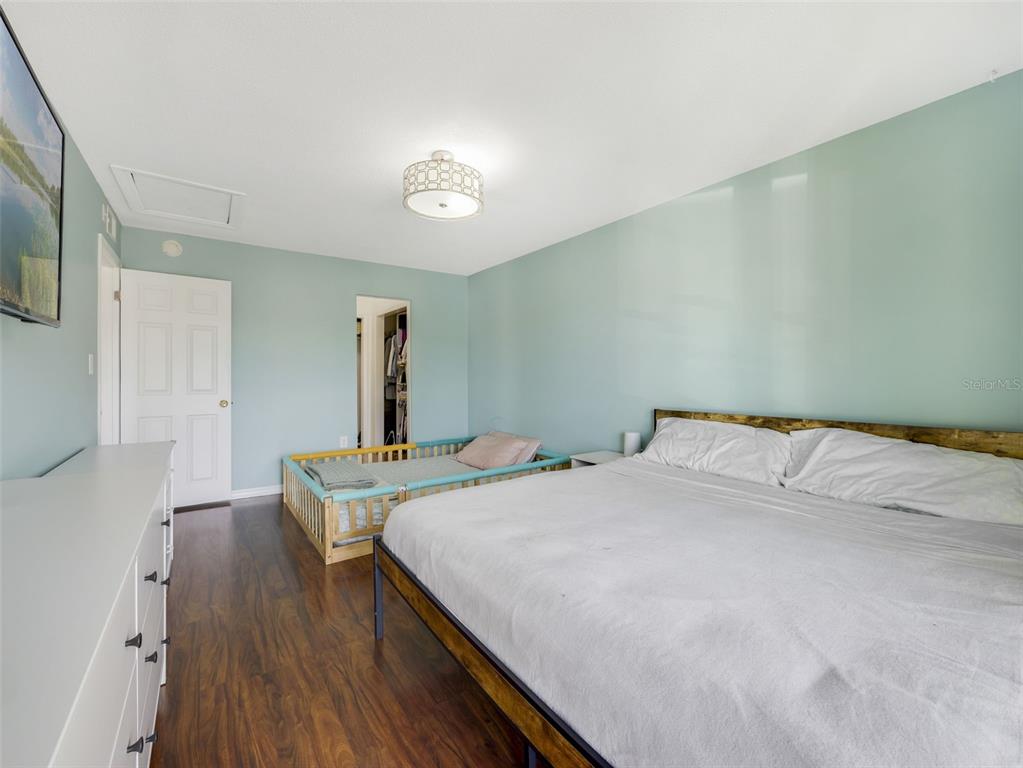 1935 South Conway Road, Unit F5 Orlando, FL 32812 - Photo 11 of 20 a bedroom with a bed and a table