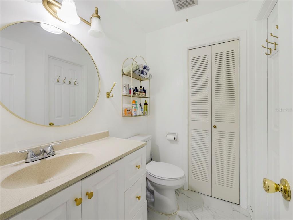 1935 South Conway Road, Unit F5 Orlando, FL 32812 - Photo 14 of 20 a bathroom with a sink a toilet and shower
