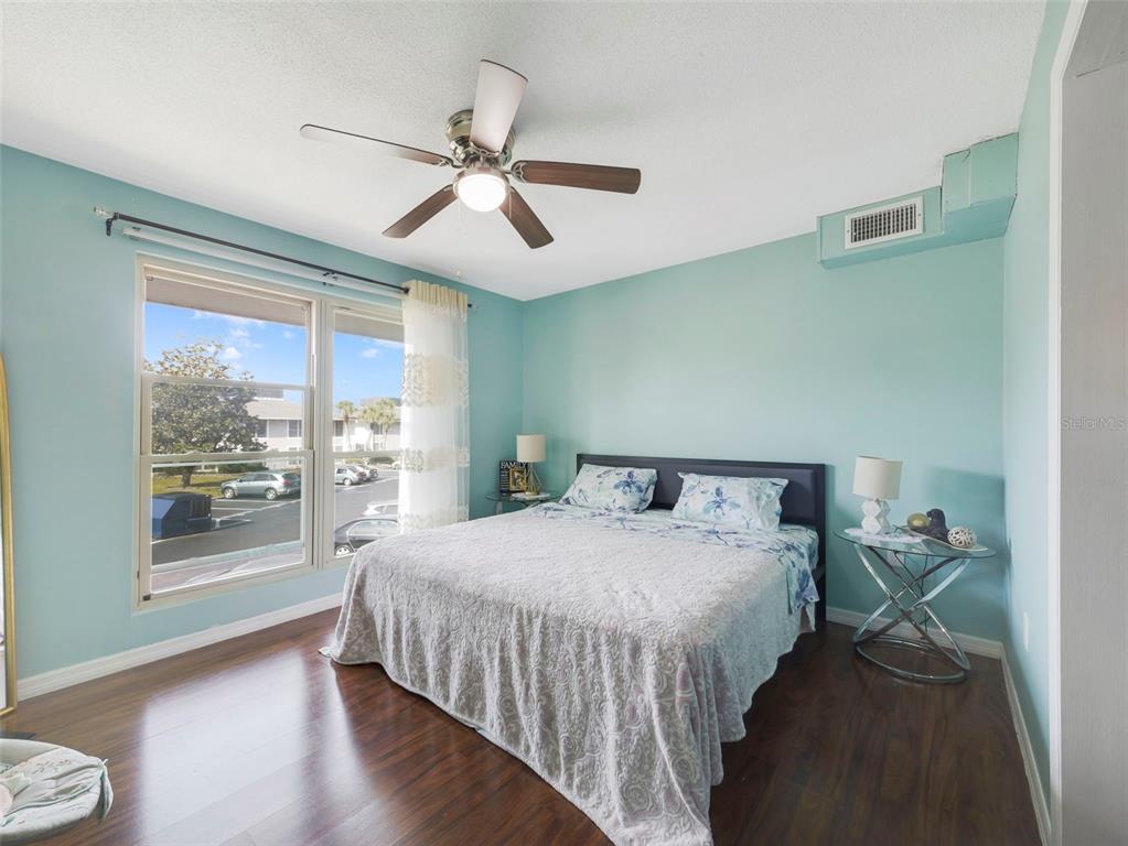 1935 South Conway Road, Unit F5 Orlando, FL 32812 - Photo 16 of 20 a bedroom with a large bed and a window
