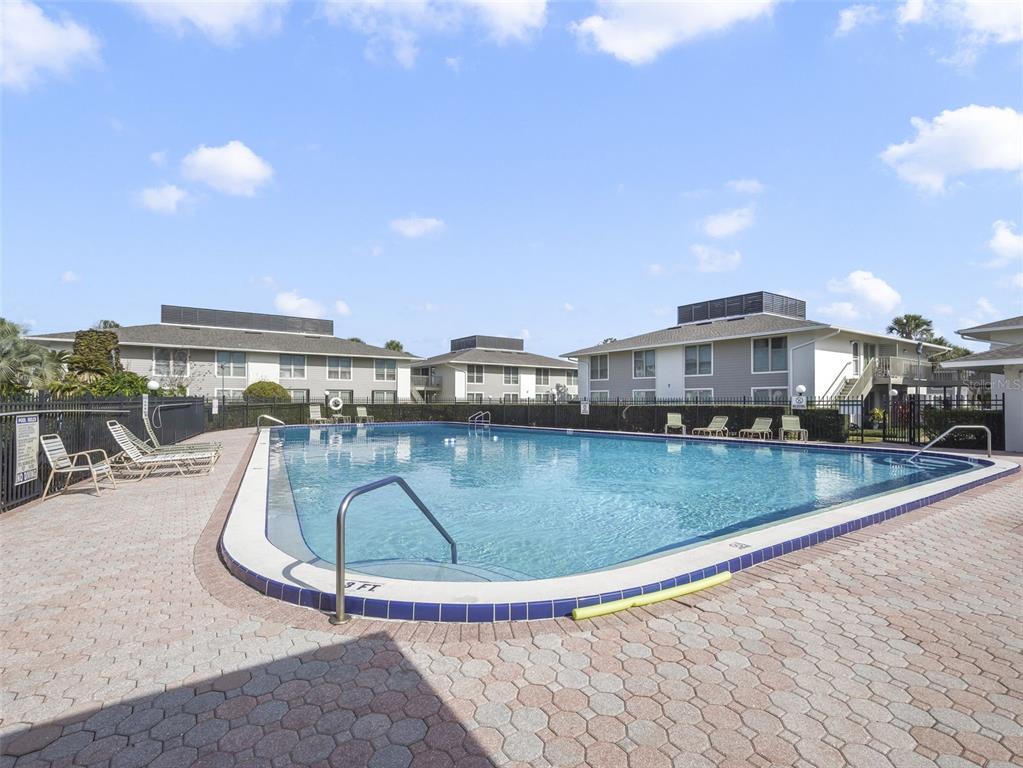 1935 South Conway Road, Unit F5 Orlando, FL 32812 - Photo 18 of 20 a view of swimming pool with outdoor seating and city view