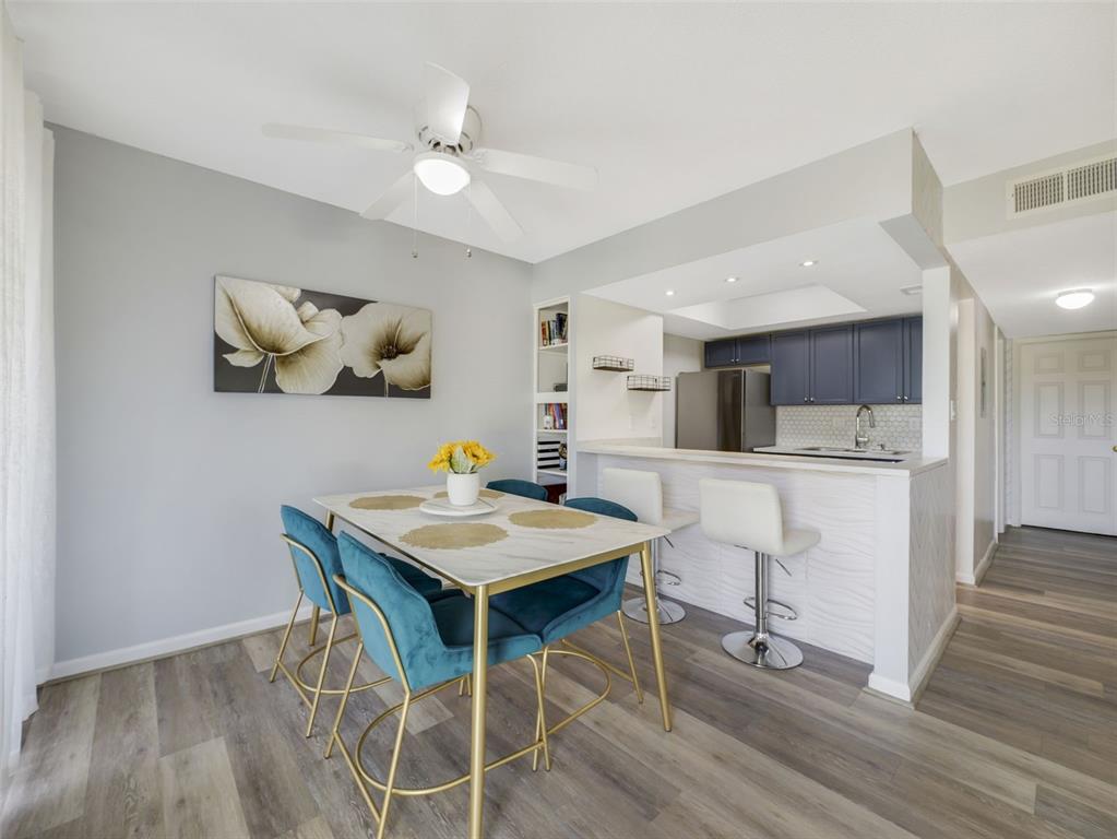 1935 South Conway Road, Unit F5 Orlando, FL 32812 - Photo 6 of 20 a view of a dining room with furniture and wooden floor