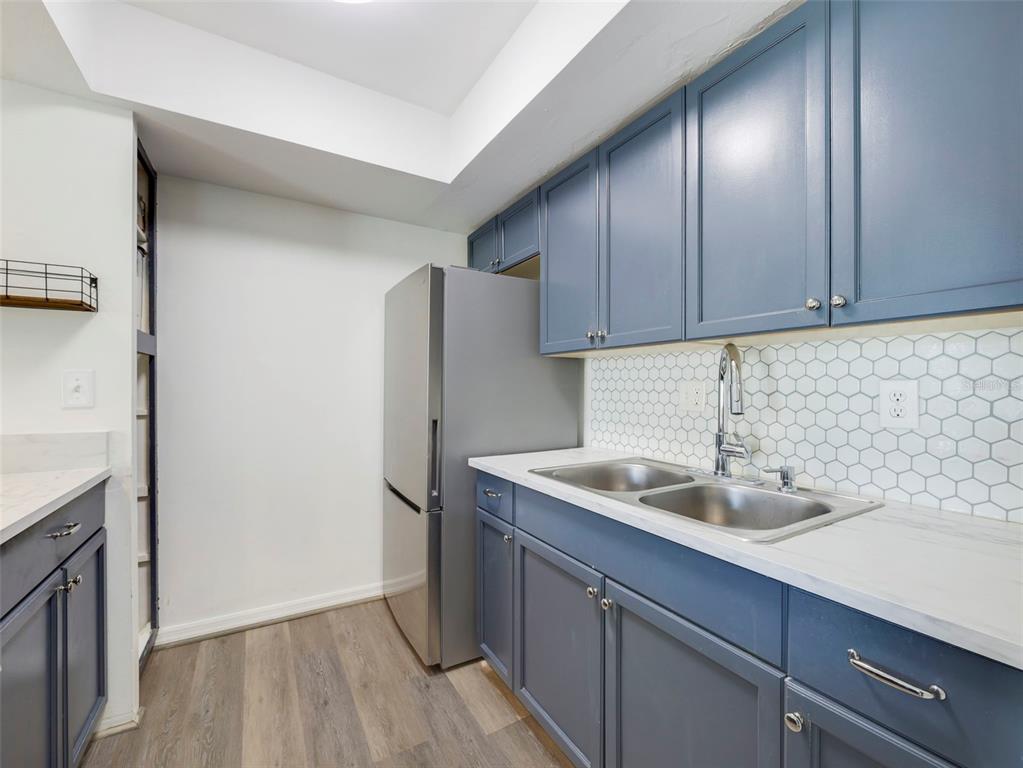 1935 South Conway Road, Unit F5 Orlando, FL 32812 - Photo 9 of 20 a kitchen with a sink and cabinets