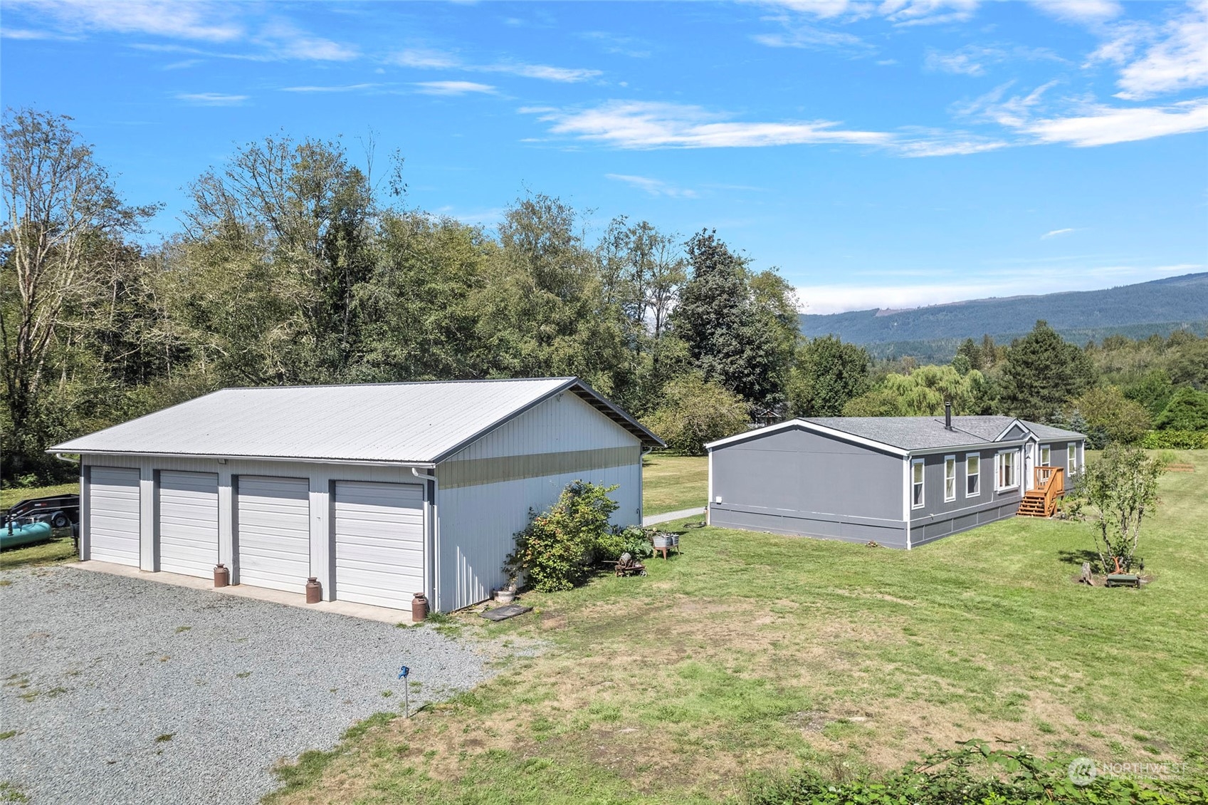 8292 Emmanuel Drive Concrete, WA 98237 - Photo 1 of 40 a view of a house with a yard and large tree