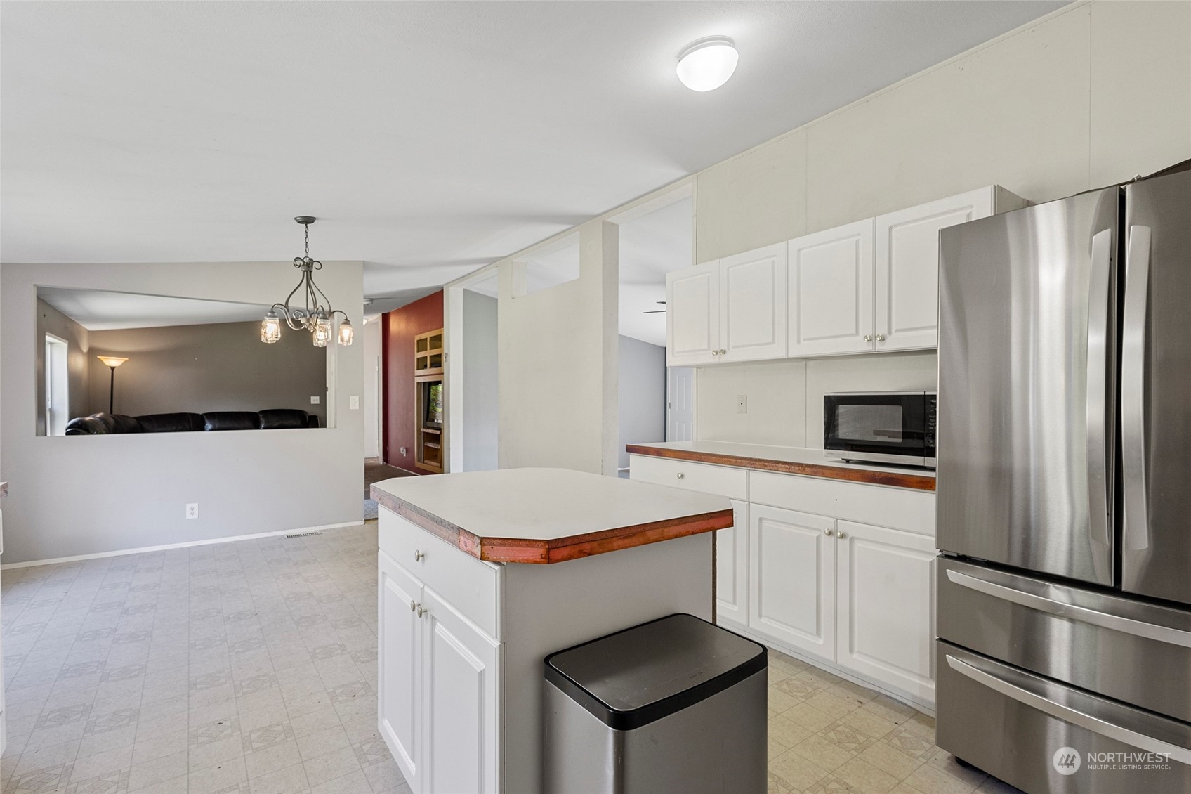 8292 Emmanuel Drive Concrete, WA 98237 - Photo 13 of 40 a kitchen with a refrigerator sink and microwave