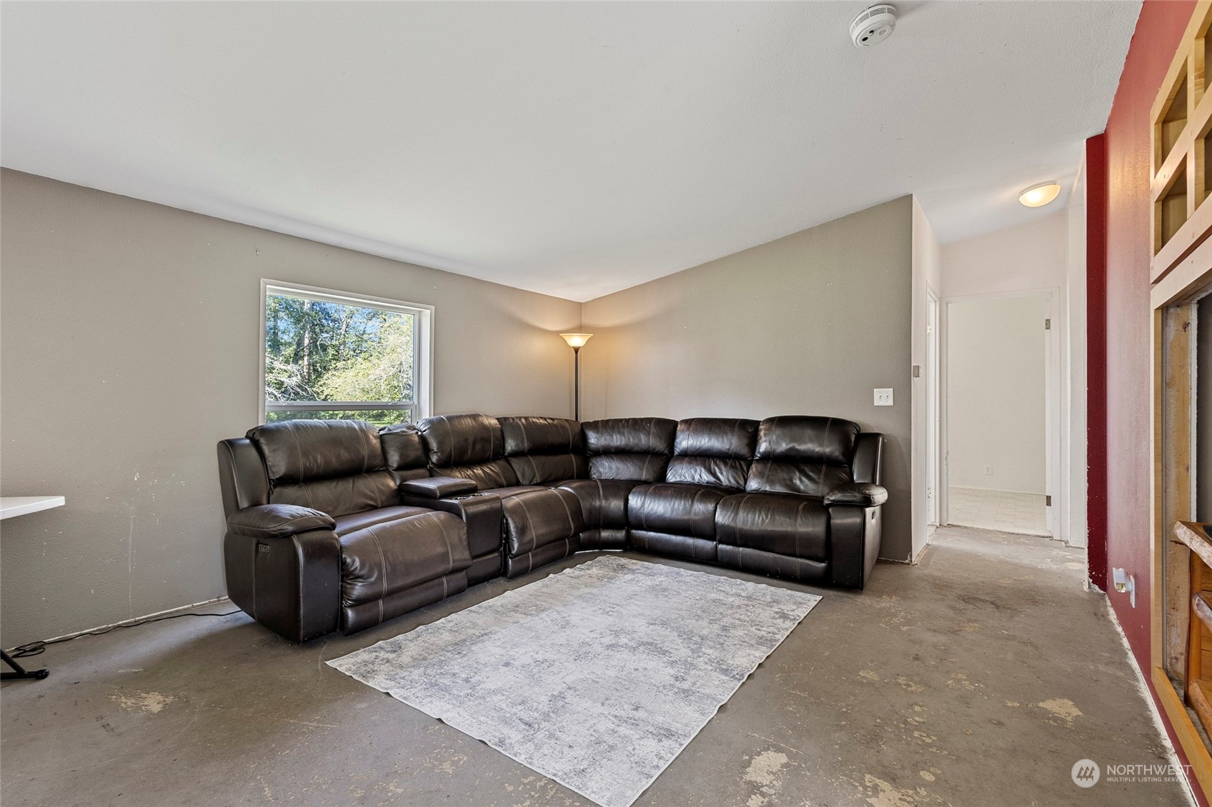 8292 Emmanuel Drive Concrete, WA 98237 - Photo 16 of 40 a living room with furniture and a rug