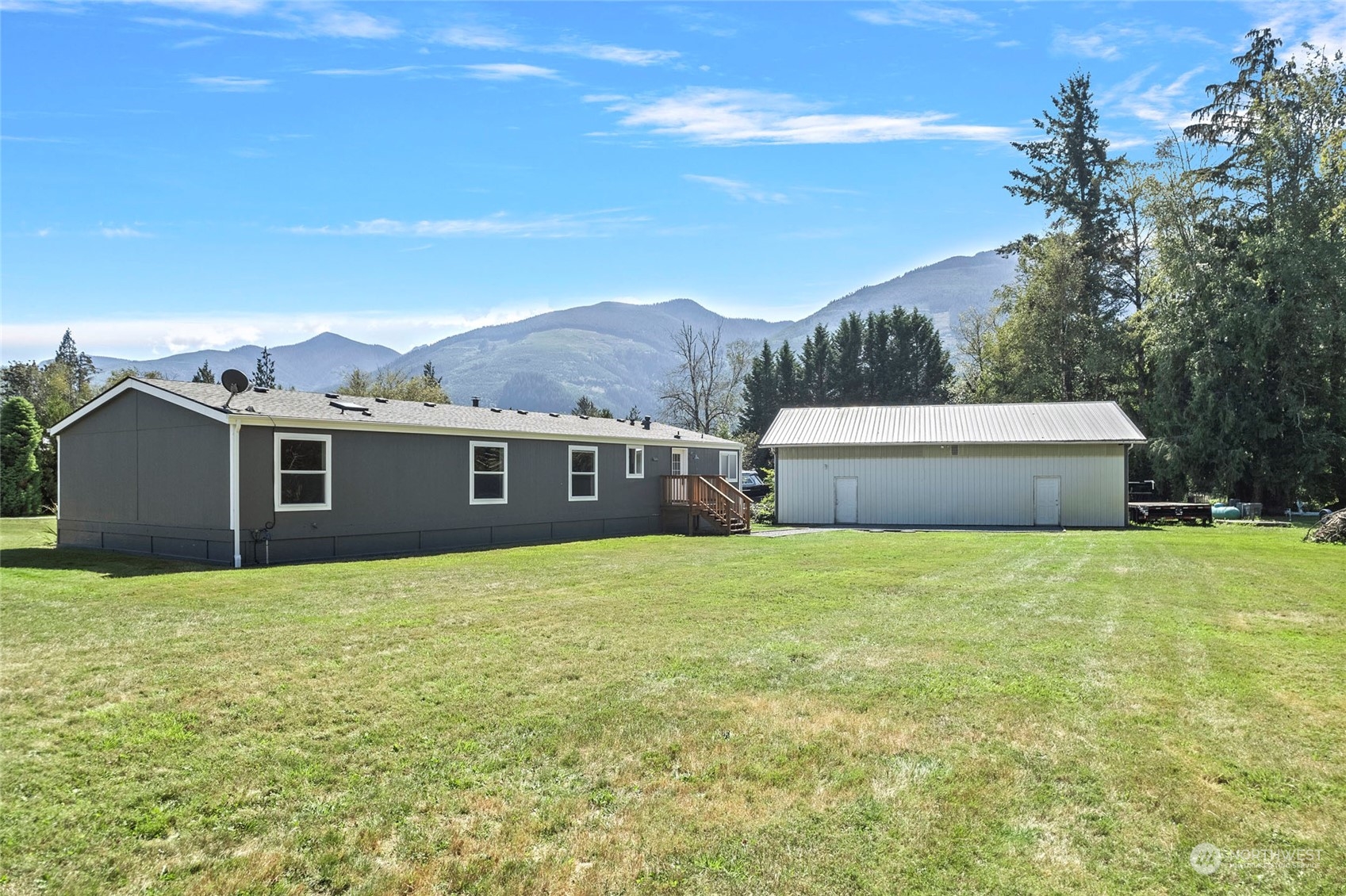 8292 Emmanuel Drive Concrete, WA 98237 - Photo 2 of 40 a house view with a big yard
