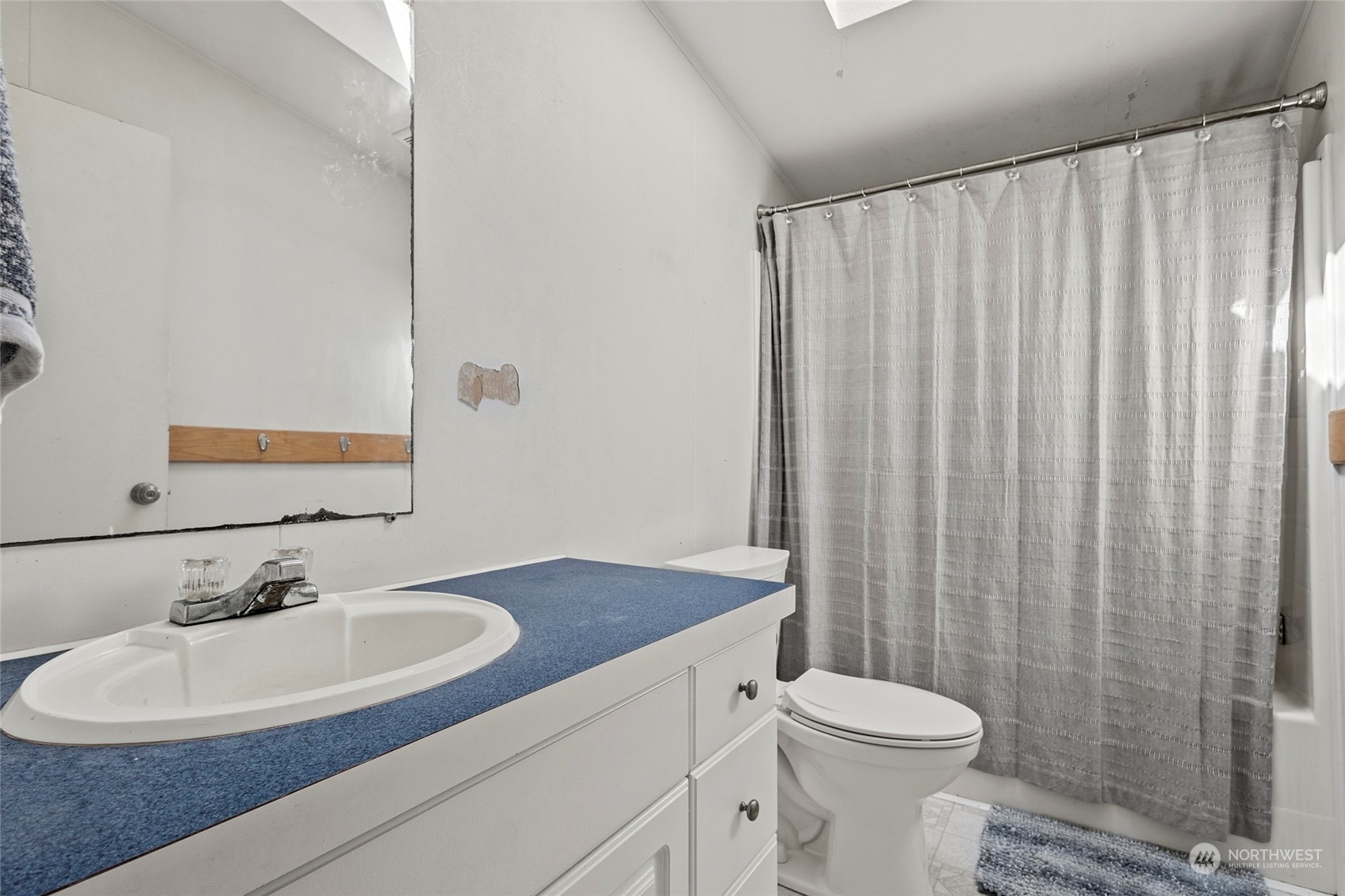 8292 Emmanuel Drive Concrete, WA 98237 - Photo 21 of 40 a bathroom with a sink toilet and shower
