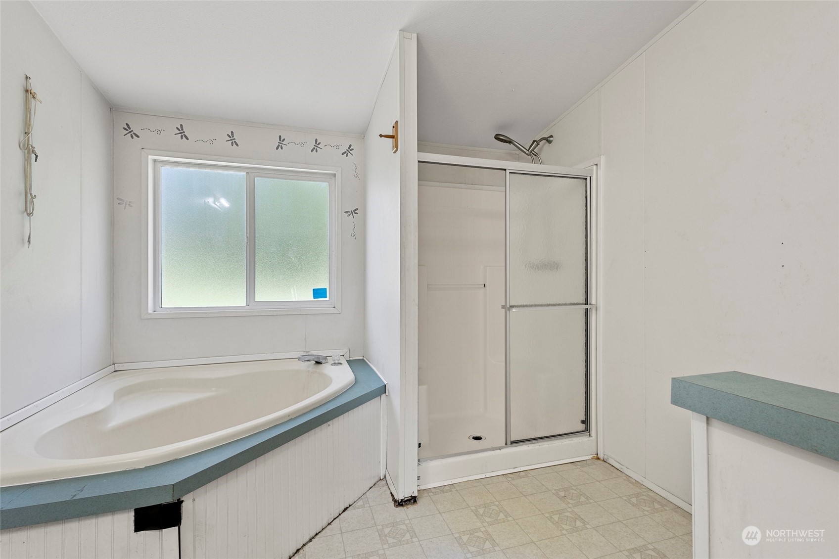 8292 Emmanuel Drive Concrete, WA 98237 - Photo 24 of 40 a bathroom with a bathtub and shower