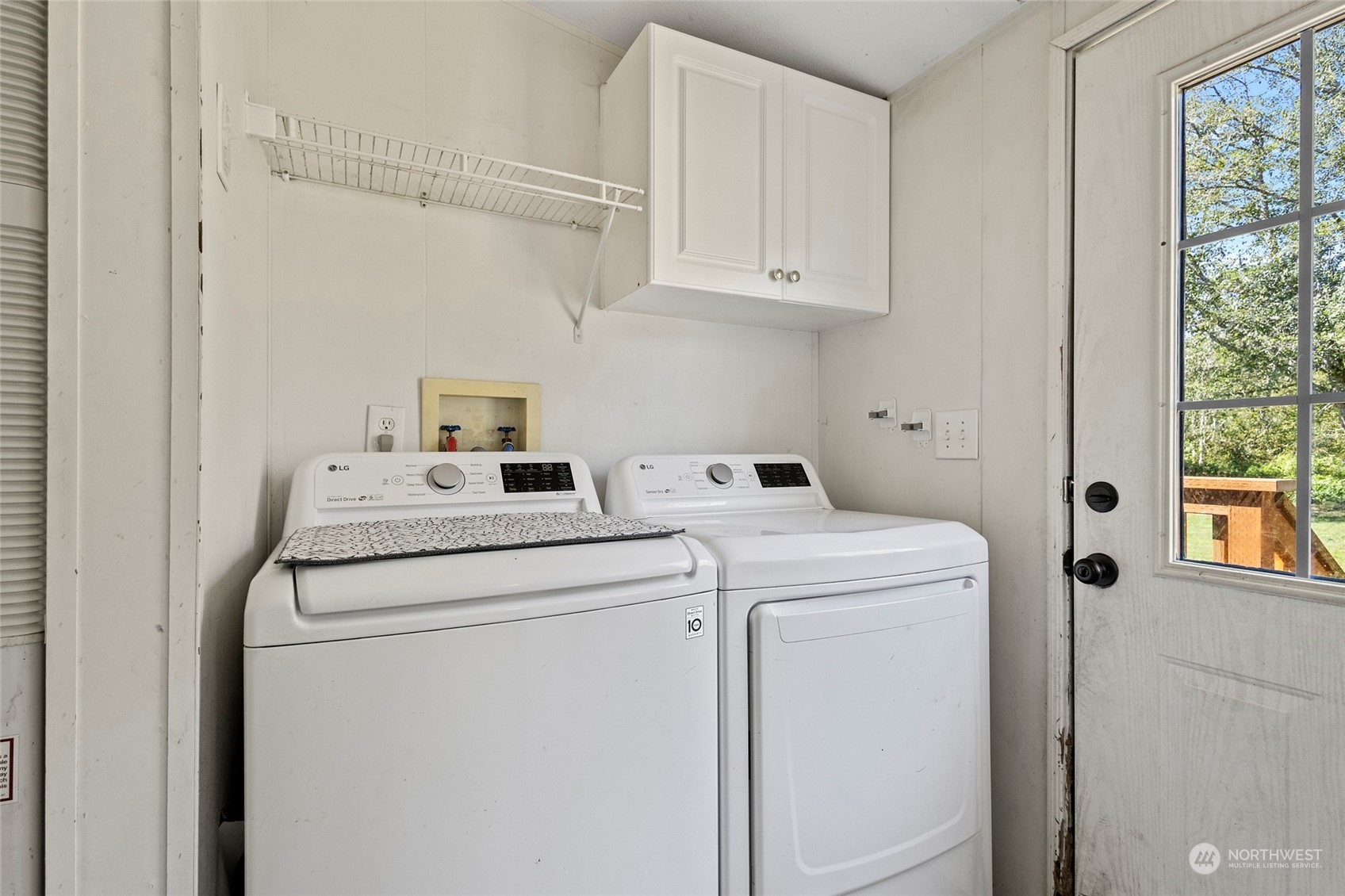 8292 Emmanuel Drive Concrete, WA 98237 - Photo 25 of 40 a utility room with dryer and washer