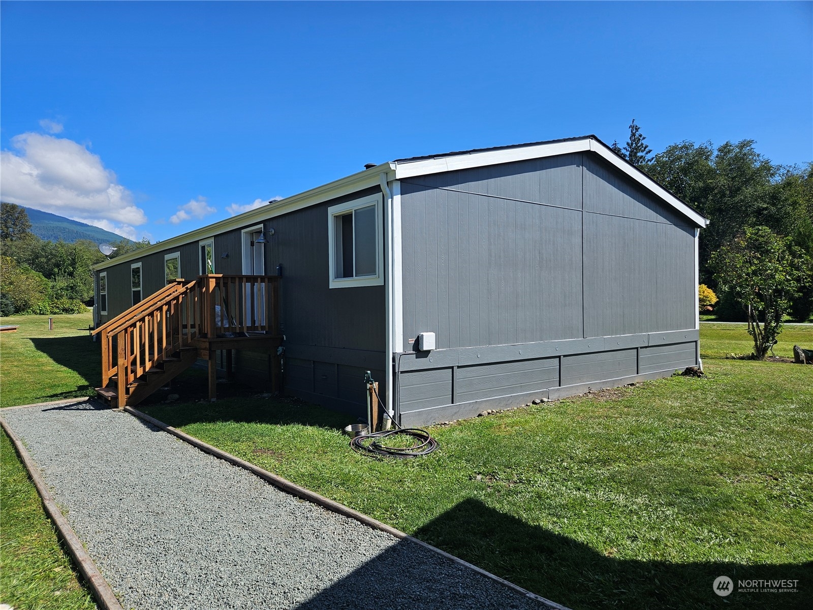 8292 Emmanuel Drive Concrete, WA 98237 - Photo 29 of 40 a view of a small house with wooden fence