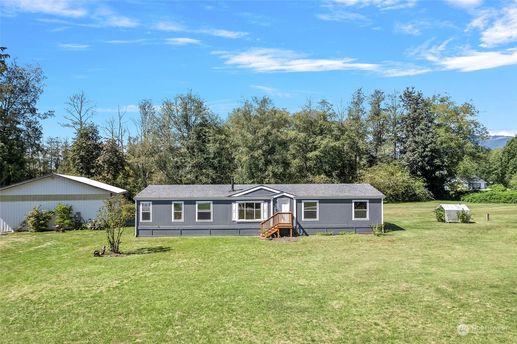 8292 Emmanuel Drive Concrete, WA 98237 - Photo 30 of 40 a front view of a house with garden