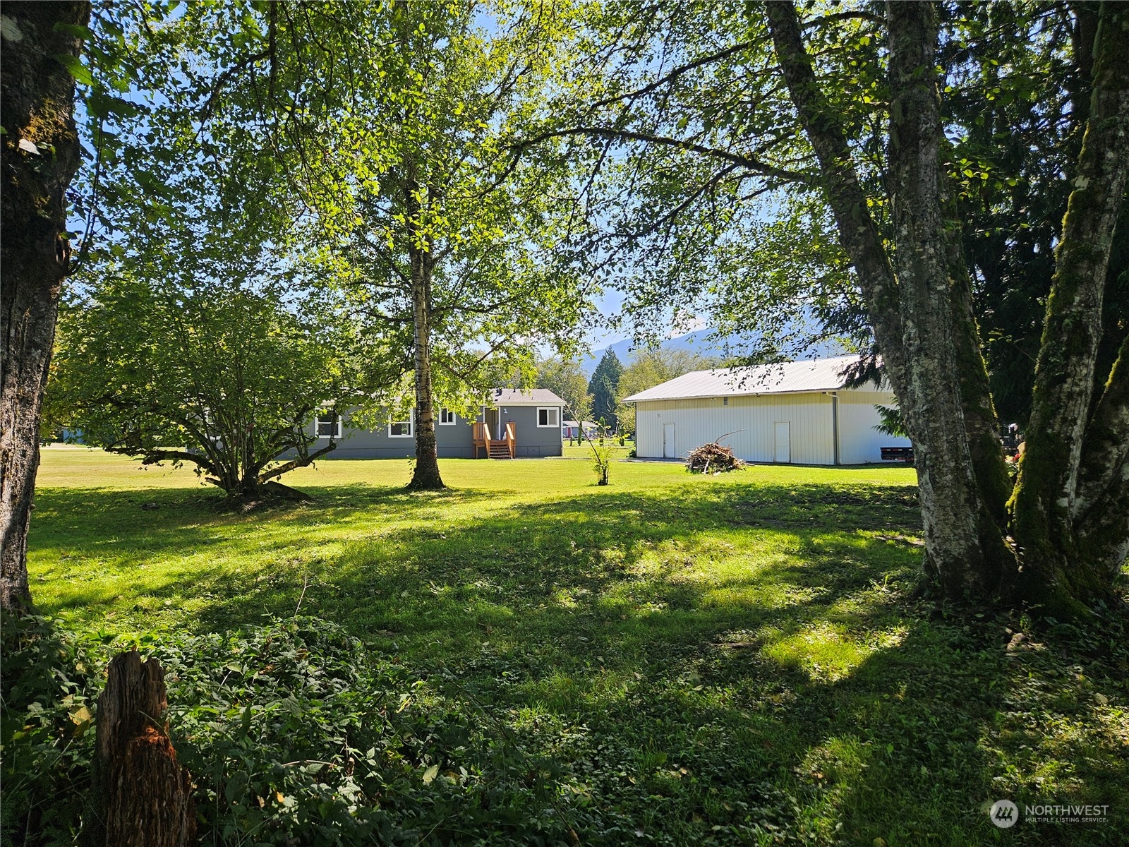 8292 Emmanuel Drive Concrete, WA 98237 - Photo 32 of 40 a view of a house with a yard