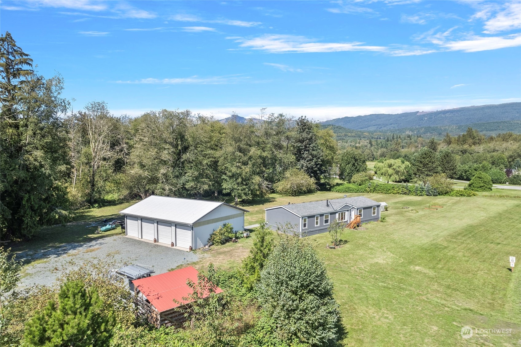 8292 Emmanuel Drive Concrete, WA 98237 - Photo 35 of 40 a view of a house with a yard