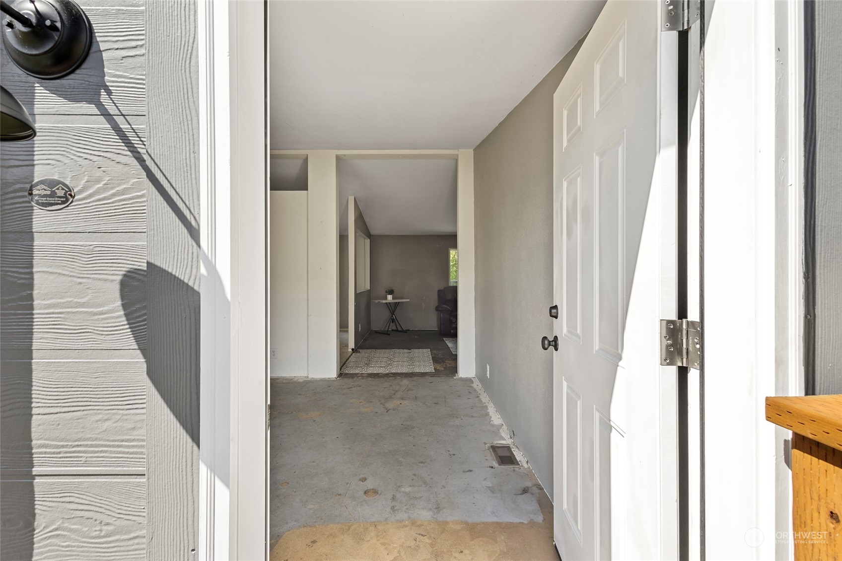 8292 Emmanuel Drive Concrete, WA 98237 - Photo 5 of 40 a view of a hallway with white walls and stairs
