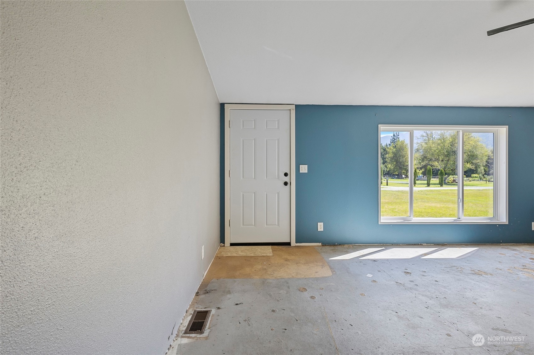 8292 Emmanuel Drive Concrete, WA 98237 - Photo 8 of 40 an empty room with a window