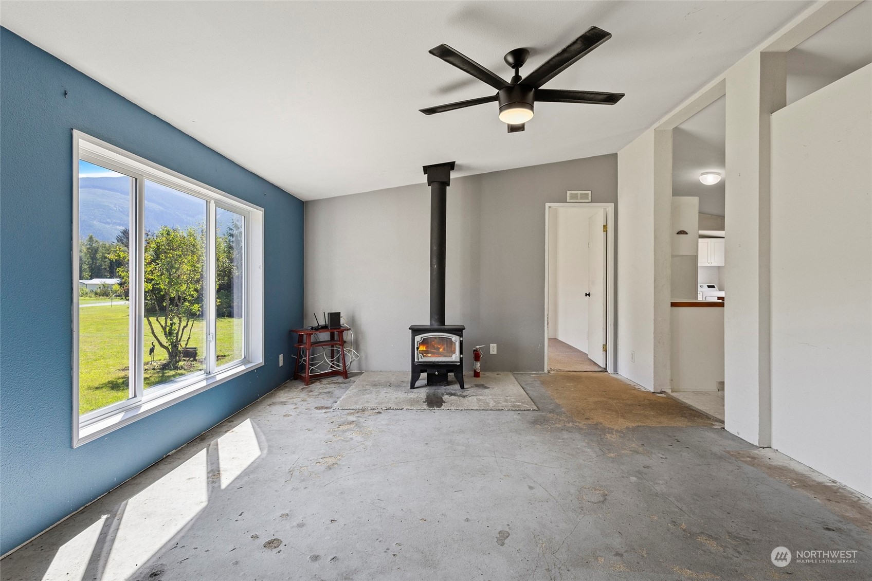 8292 Emmanuel Drive Concrete, WA 98237 - Photo 9 of 40 a living room with furniture and a large window