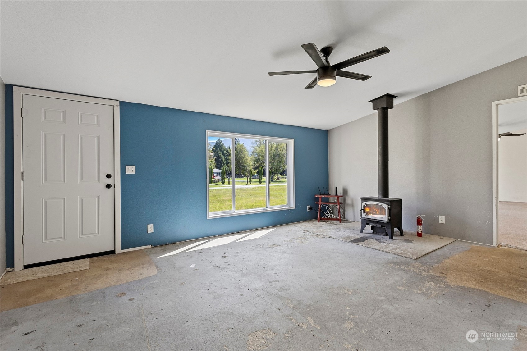 8292 Emmanuel Drive Concrete, WA 98237 - Photo 10 of 40 a view of a livingroom with a ceiling fan and window