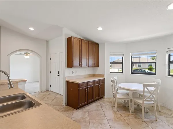 a view of a kitchen filled with furniture and window