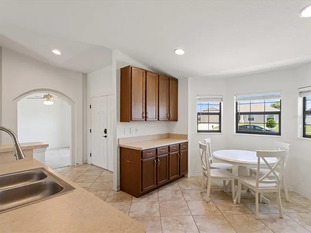 a view of a kitchen filled with furniture and window