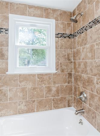 185 Redlands Street Springfield, MA 01104 - Photo 20 of 28 a bathroom with a bathtub and shower